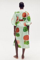 Profile view of model wearing the Oroton Posie Garden Column Dress in Sea Spray and 100% silk for Women