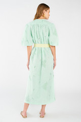 Profile view of model wearing the Oroton Lace Column Dress in Sea Spray and 100% polyester for Women
