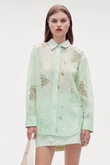 Profile view of model wearing the Oroton Lace Overshirt in Sea Spray and 100% polyester for Women