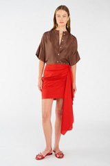 Profile view of model wearing the Oroton Poplin Short Sarong Skirt in Poppy and 100% cotton for Women