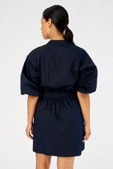 Profile view of model wearing the Oroton Zip Utility Dress in North Sea and 100% cotton for Women