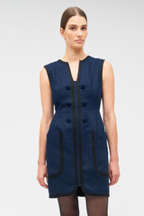 Profile view of model wearing the Oroton Contrast Bind Shift Dress in North Sea and 100% linen for Women