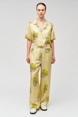 Profile view of model wearing the Oroton Linear Tulip Pj Pant in Fennel and 100% silk for Women