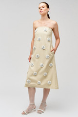 Profile view of model wearing the Oroton Flower Sequin Gown in Limestone and 100% linen for Women