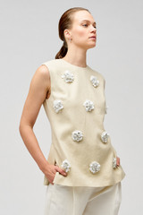Profile view of model wearing the Oroton Flower Sequin Tunic in Limestone and 100% linen for Women