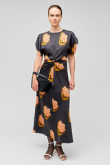 Profile view of model wearing the Oroton Linear Tulip Print Dress in Black and 100% silk for Women . IP:2