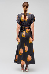 Profile view of model wearing the Oroton Linear Tulip Print Dress in Black and 100% silk for Women . IP:5