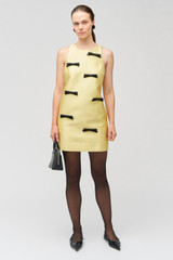 Profile view of model wearing the Oroton Bow Detail Shift Dress in Lemon Zest and 85% polyester, 15% silk for Women . IP:2