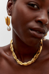 Profile view of model wearing the Oroton Alma Necklace in Worn Gold and Brass for Women . IP:2