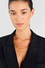 Profile view of model wearing the Oroton Kimberley Pearl Lariat Necklace in Gold/Pearl and Brass for Women . IP:4