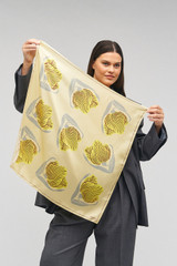Profile view of model wearing the Oroton Linear Tulip Scarf in Fennel and 100% silk for Women