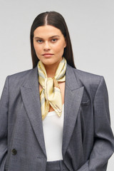 Profile view of model wearing the Oroton Linear Tulip Scarf in Fennel and 100% silk for Women