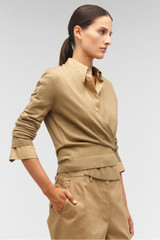 Profile view of model wearing the Oroton Wrap Cardigan in Dark Camel and 100% merino wool for Women