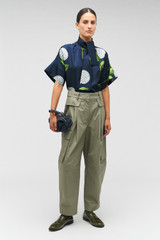 Profile view of model wearing the Oroton Cargo Pant in Sage and 100% cotton for Women