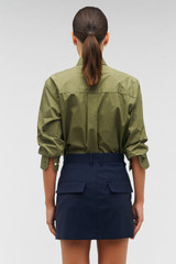Profile view of model wearing the Oroton Mini Trouser Skirt in North Sea and 98%  wool, 2% elastane for Women