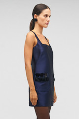 Profile view of model wearing the Oroton Fringe Beaded Mini Dress in North Sea and 85% polyester, 15% silk for Women