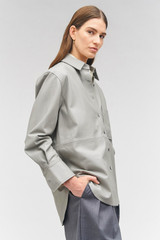 Profile view of model wearing the Oroton Leather Overshirt in Mist and 100% leather for Women
