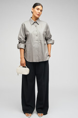 Profile view of model wearing the Oroton Leather Overshirt in Mist and 100% leather for Women