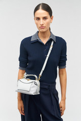Profile view of model wearing the Oroton Mica Mini Bowler in Mist and Pebble leather for Women . IP:5