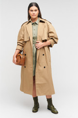 Profile view of model wearing the Oroton Trench in Dark Camel and 65% polyester, 35% cotton for Women . IP:8