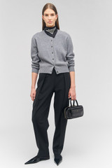 Profile view of model wearing the Oroton Silk Scarf Detail Cardigan in Grey Marle and 100% wool for Women . IP:2