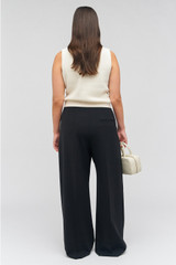 Profile view of model wearing the Oroton Contrast Waist Pant in Black and 53% poly, 42% wool, 5% elastane for Women . IP:9