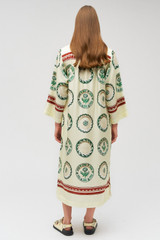 Profile view of model wearing the Oroton Alfresco Print Column Dress in Pale Lemon and 100% silk for Women