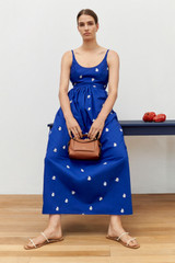 Profile view of model wearing the Oroton Embroidered Fruit Sundress in Azure Blue and 100% cotton for Women . IP:6