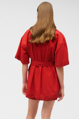 Profile view of model wearing the Oroton Fringe Detail Dress in Poppy and 100% cotton for Women .