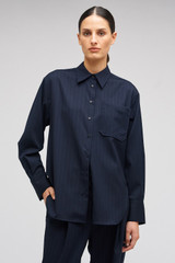 Profile view of model wearing the Oroton Pinstripe Overshirt in North Sea and 95% WOOL 5% ELASTANE for Women . IP:3