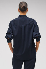 Profile view of model wearing the Oroton Pinstripe Overshirt in North Sea and 95% WOOL 5% ELASTANE for Women . IP:9