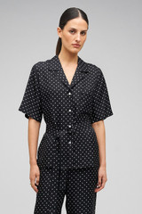 Profile view of model wearing the Oroton Long Belted Camp Shirt in Black/Cream and 100% Silk for Women .