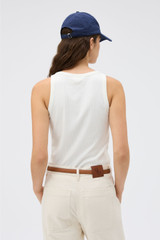 Profile view of model wearing the Oroton Lottie Rib Tank in Antique White and 92% Cotton / 8% Spandex for Women