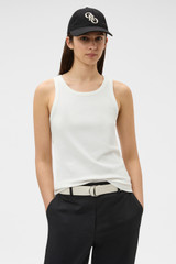 Profile view of model wearing the Oroton Lottie Rib Tank in Antique White and 92% Cotton / 8% Spandex for Women . IP:2