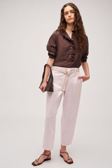 Profile view of model wearing the Oroton Arlo Carpenter Chino in Palest Pink and 100% cotton fabric for Women