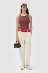 Profile view of model wearing the Oroton Lottie Rib Tank in Chocolate and 92% Cotton / 8% Spandex for Women . IP:2