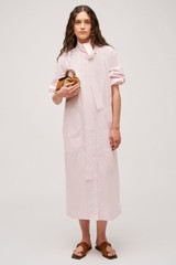 Profile view of model wearing the Oroton Cleo Poplin Dress in Palest Pink and 100% Cotton Poplin for Women