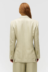 Profile view of model wearing the Oroton Wrap Blazer in Laurel and 58% Viscose 42% Linen for Women . IP:5
