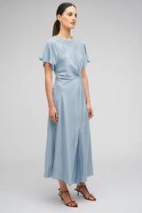 Profile view of model wearing the Oroton Drape Front Dress in Denim Blue and 92% Silk 8% Spandex for Women . IP:4