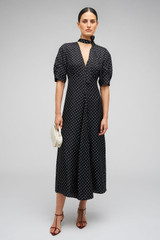 Profile view of model wearing the Oroton Spot Print Day Dress in Black and 100% Silk for Women . IP:2