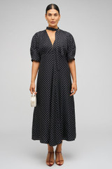 Profile view of model wearing the Oroton Spot Print Day Dress in Black and 100% Silk for Women . IP:8