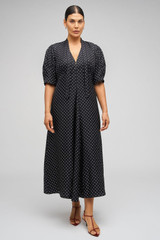 Profile view of model wearing the Oroton Spot Print Day Dress in Black and 100% Silk for Women . IP:9