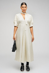 Profile view of model wearing the Oroton Spot Print Day Dress in Cream and 100% Silk for Women . IP:8