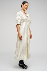 Profile view of model wearing the Oroton Spot Print Day Dress in Cream and 100% Silk for Women . IP:10