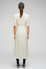 Profile view of model wearing the Oroton Spot Print Day Dress in Cream and 100% Silk for Women . IP:5