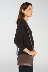 Profile view of model wearing the Oroton Inez Slim Crossbody in Coffee Bean and Shiny soft saffiano leather for Women . IP:3