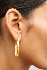 Profile view of model wearing the Oroton Livia Enamel Drop Earring in Worn Gold/Antique White and  for Women . IP:2