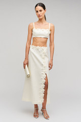 Profile view of model wearing the Oroton Rosebud Lace Skirt in Soft Cream and 100% linen material for Women . IP:2