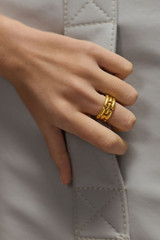 Profile view of model wearing the Oroton Kylo Ring in Worn Gold and  for Women