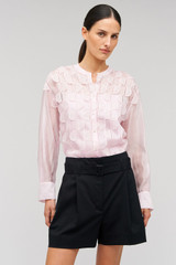Profile view of model wearing the Oroton Scallop Lace Overshirt in Pink Rose and 85% Tencel 15% Polyester for Women